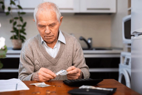 A wealthy man pondering over his overflowing barns.