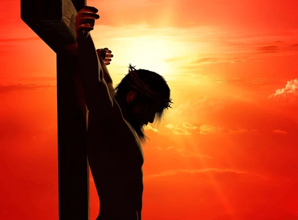 An image of a cross with a sunset background, symbolizing sacrifice and redemption.