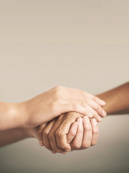 An image of two individuals from opposing sides embracing, symbolizing reconciliation and peace.