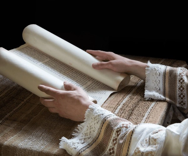 A scroll unrolling to reveal ancient prophecies.